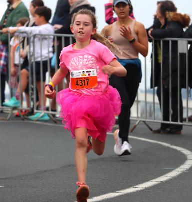 In the pink ... Ivy Westhead, 9, completes the 5km fun run. PHOTO: SIMON HENDERSON