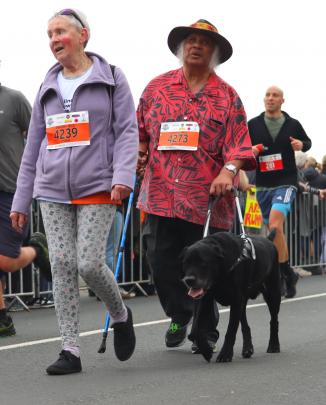 Final steps ... Completing the 5km fun run are guide Yvonne Banwell and Nooapii Rouvi with his...