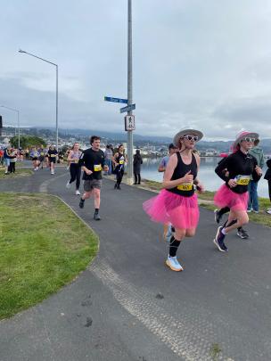 Colour burst ... Looking cheerful in pink tutus during the half marathon  are Katrin Visser (1671...