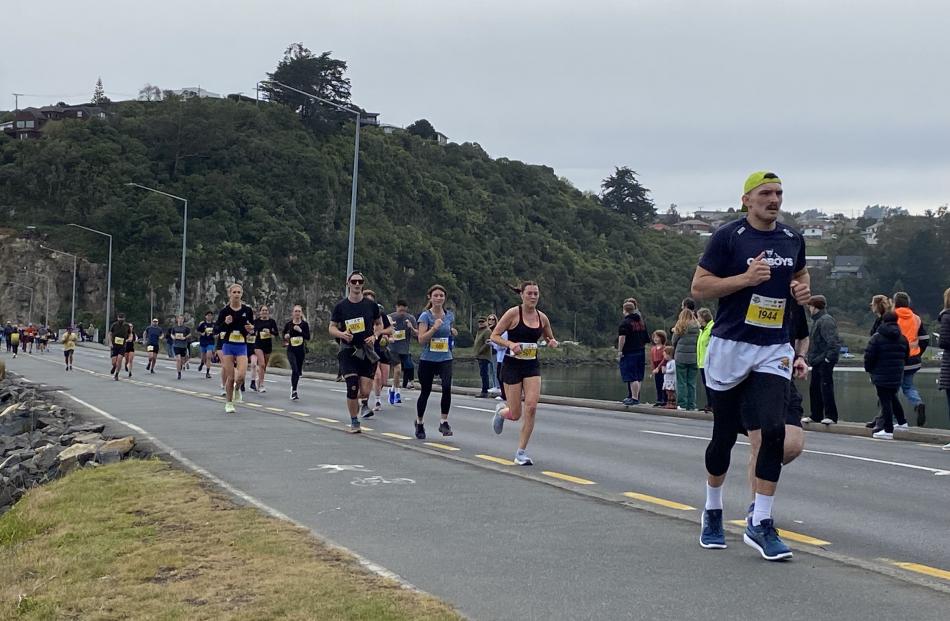 Across the water ... Aden Young (1944) heads across the Andersons Bay causeway on the final leg...