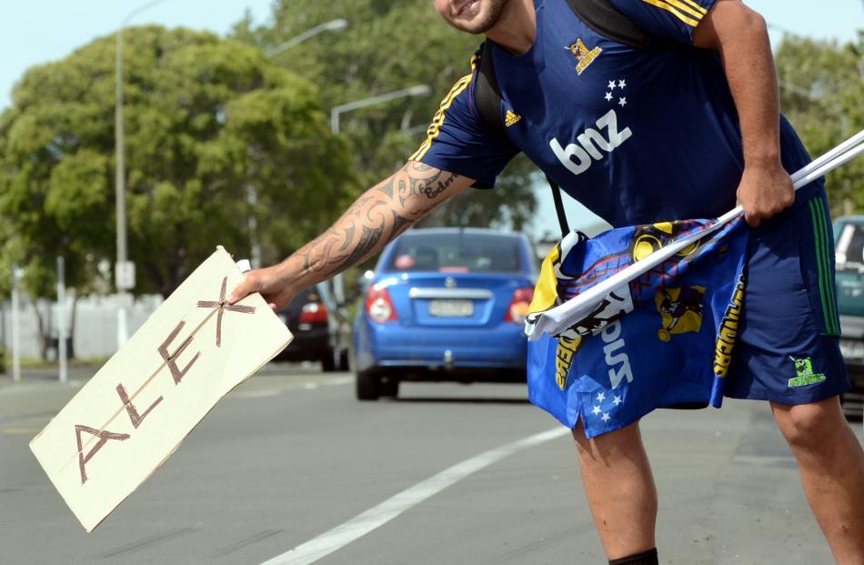 Highlander Brendon Edmonds hitchhikes on Cumberland St, Dunedin, yesterday as part of the...