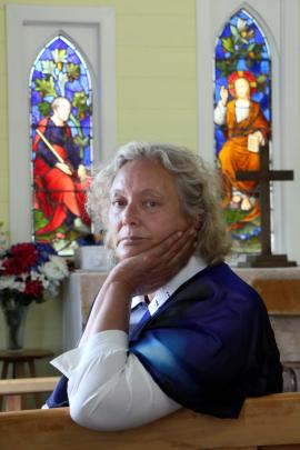 Te Runanga o Moeraki member Nola Tipa (57) in front of the stained-glass window in the historic...