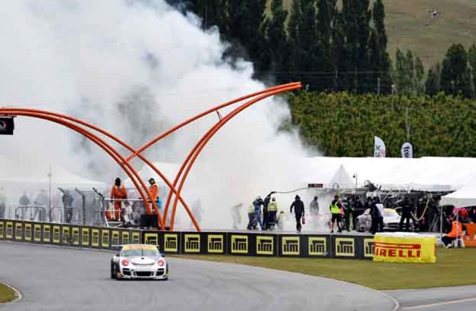 A scary fire erupted in the pit lane during running of the Highlands 101 feature race. Members of...