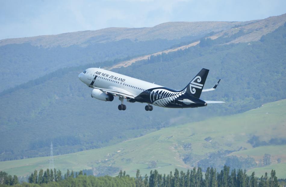 An Air New Zealand Airbus A320 departs Dunedin  Airport. Photo by Stephen Jaquiery.