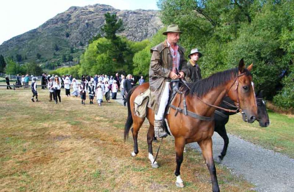 A crowd of 60 Wakatipu residents followed in a re-enactment of the pioneers' horse trek.