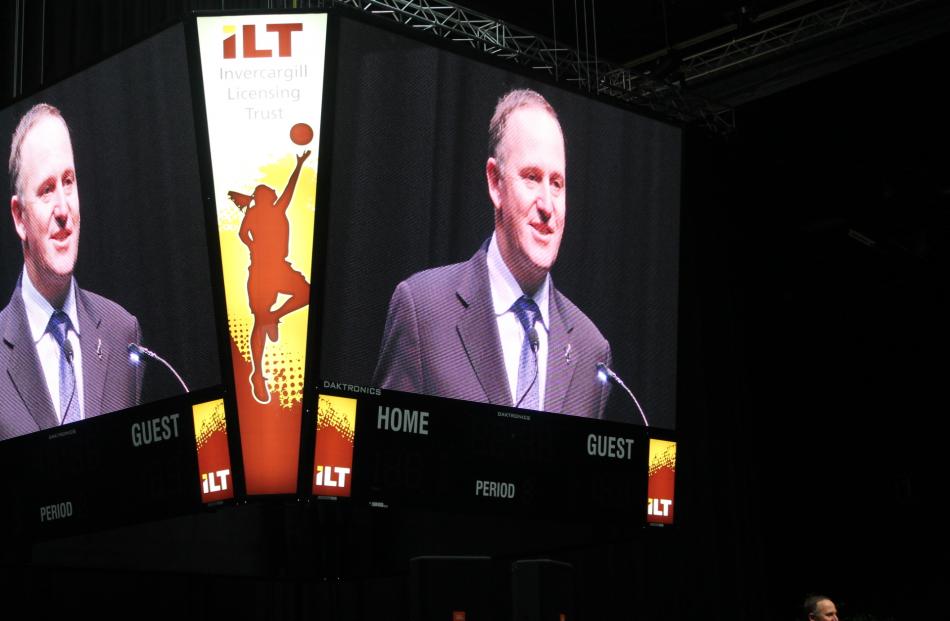 .  Prime Minister John Key's image is projected on the stadium's four-sided 'Monstavision' screen...