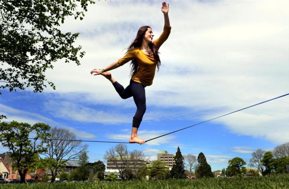 University of Otago anthropology student Michelle Henderson relaxes on a tightrope at the North...