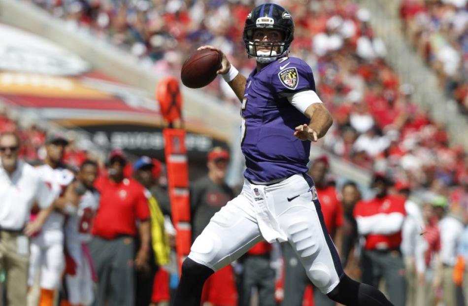 American football: Flacco throws five TDs as top quarterbacks