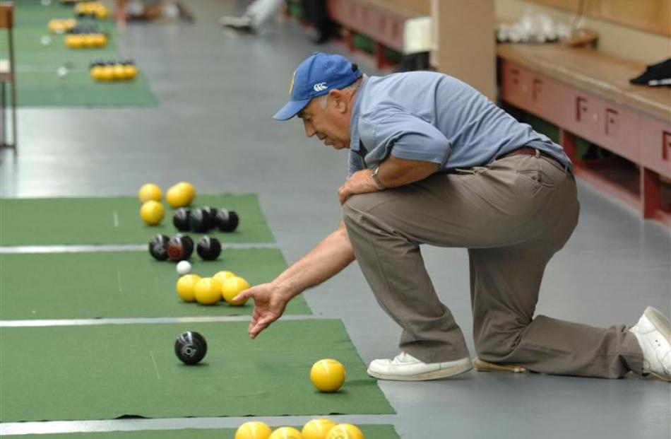 Bob Crawford, of Mosgiel, on his way to the gold medal in the men's 61 and over indoor bowls...