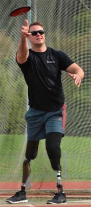 Curtis McGrath, who lost both his legs on army duty in Afghanistan, practises his discus throw at...