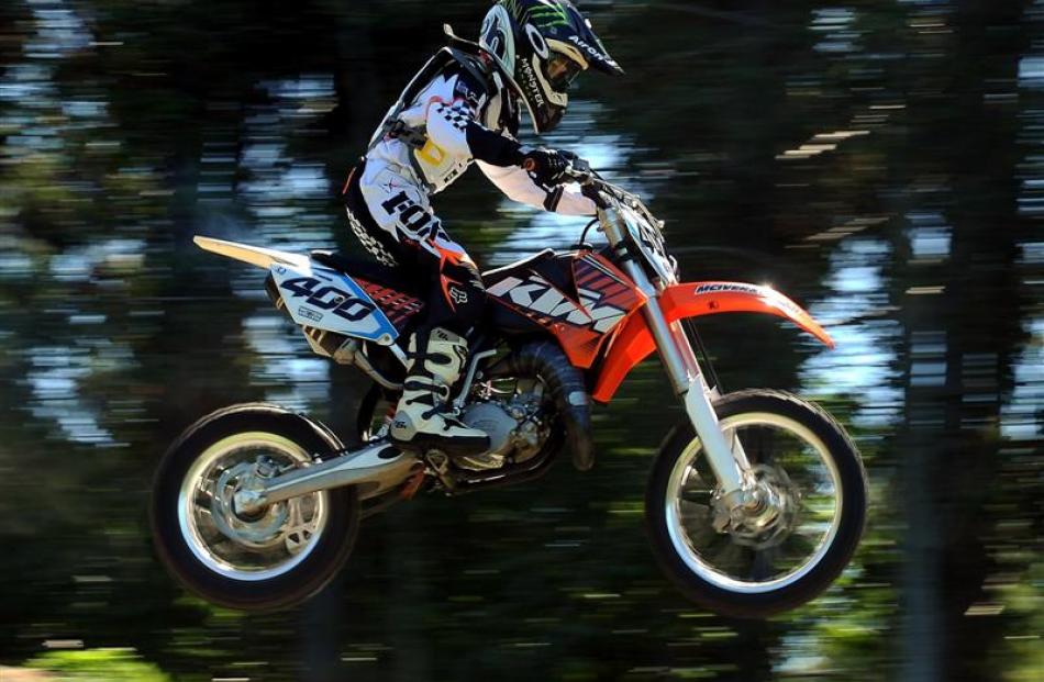 Dunedin motocross rider Grason Veith makes a big jump during  practice. Photo by Peter McIntosh.