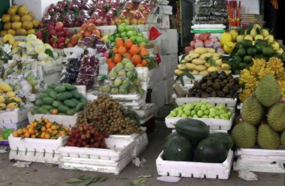 Fresh fruit is piled high in a Hanoi market.