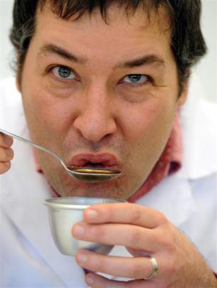 Mario Fernandez demonstrates the cupping technique, an assessment method which is used to...