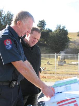 New Zealand Fire Service region 5 property co-ordinator Stephen Hill [left] and Wanaka chief fire...