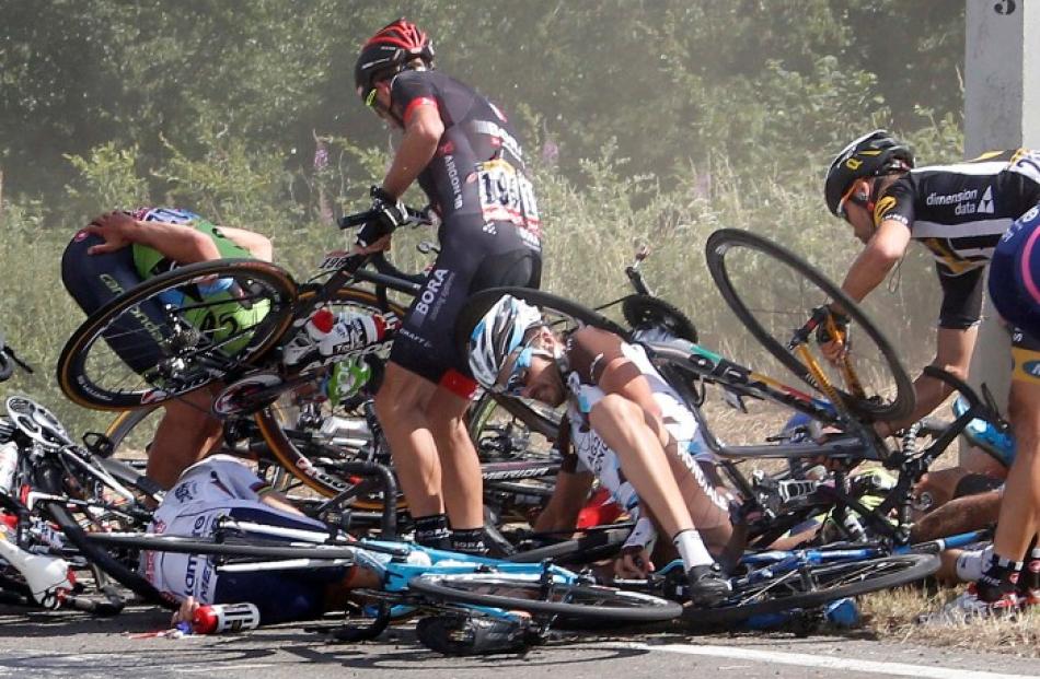 Riders and their bikes on the road following the crash during the 159.5km third stage of the Tour...