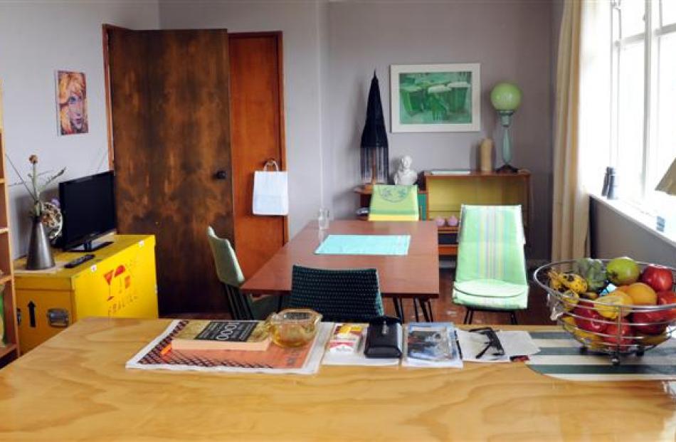 The dining area which is furnished with secondhand furniture.