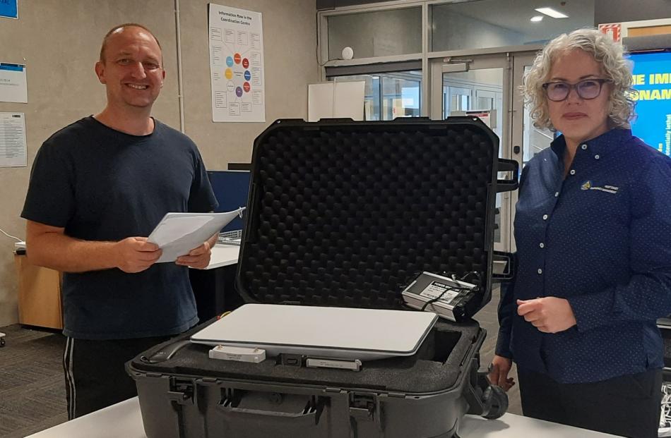 Technician Jason Somerville and Claire Brown with one of the Starlink kits now deployed around...