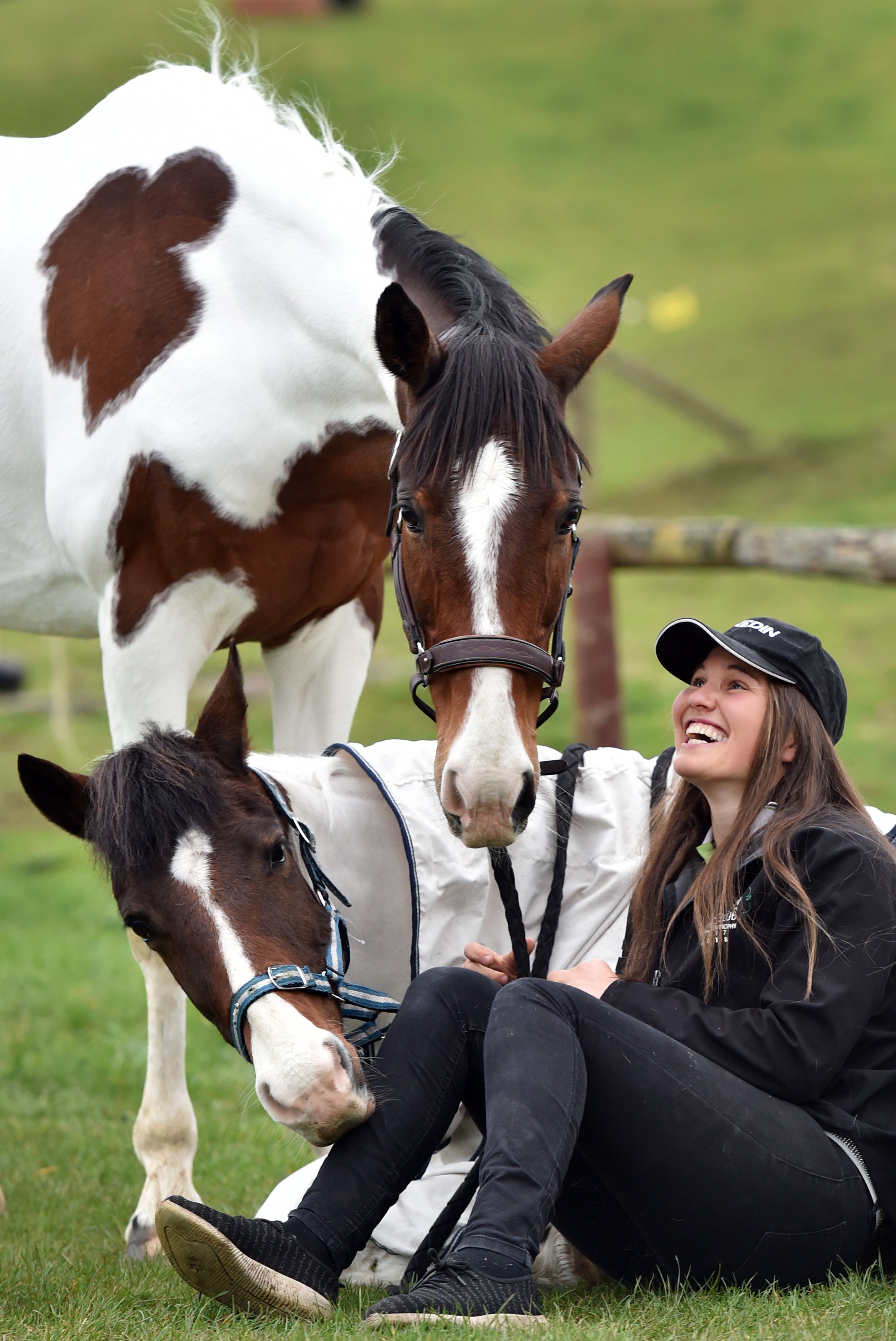 Talia Allison, of Dunedin, with horse Mustang Shelby (standing) and Mustang Puzzle Me who will...