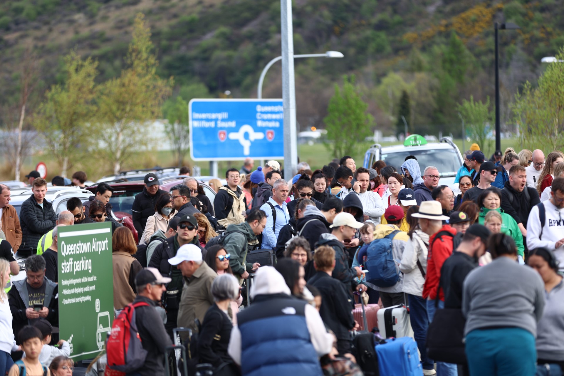 Travellers were evacuated from the airport following a bomb threat this morning. Photo: James...