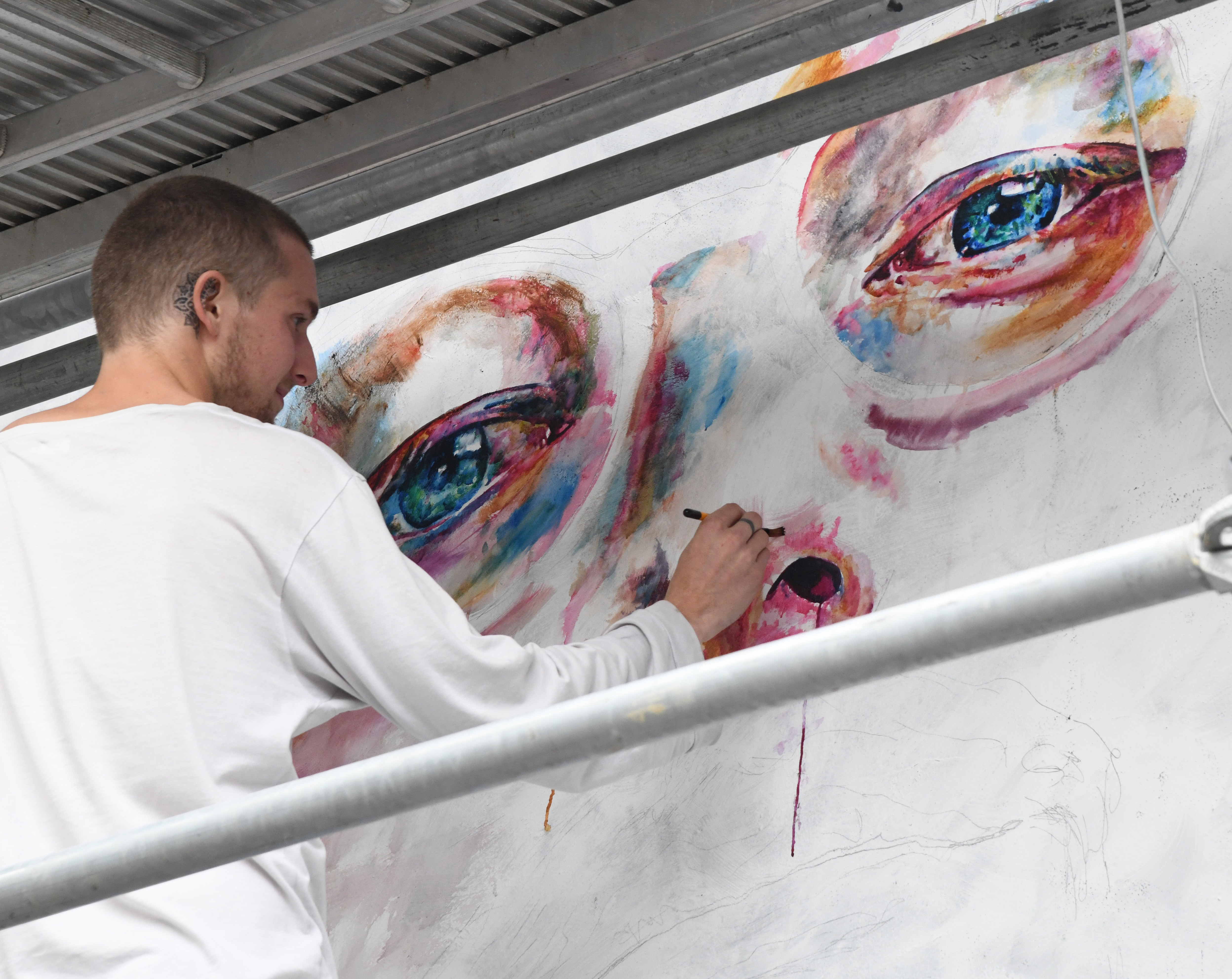 Dunedin artsit Tyler Kennedy Stent works on his Ed Sherran mural in Bath Street. Photo: Craig Baxter