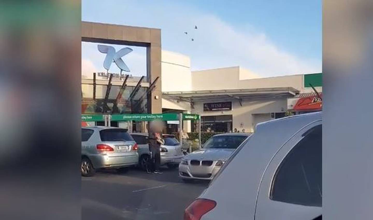 A man is seen throwing eggs at a vehicle outside a shopping centre in Kelston, West Auckland....