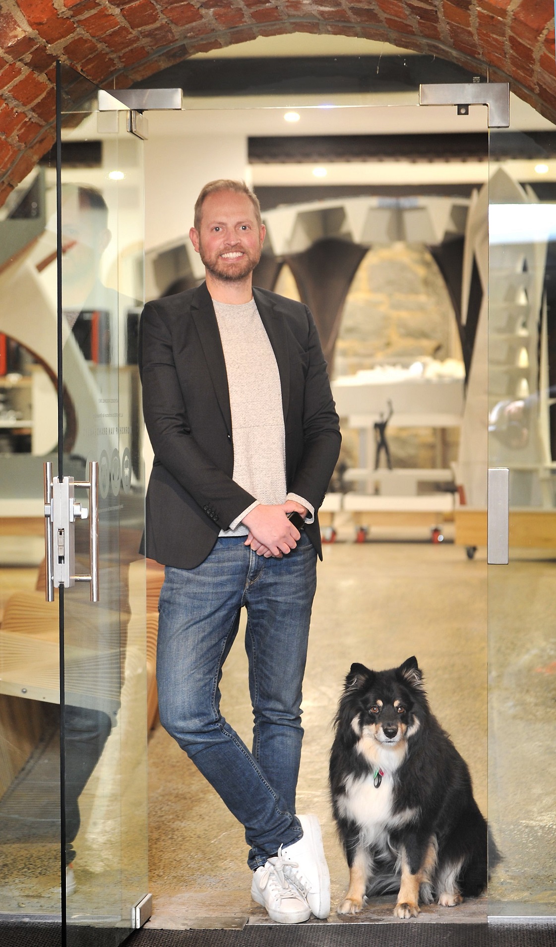 Damien van Brandenburg in his Clarion House office with his dog, Lulu. Photo: Christine O'Connor
