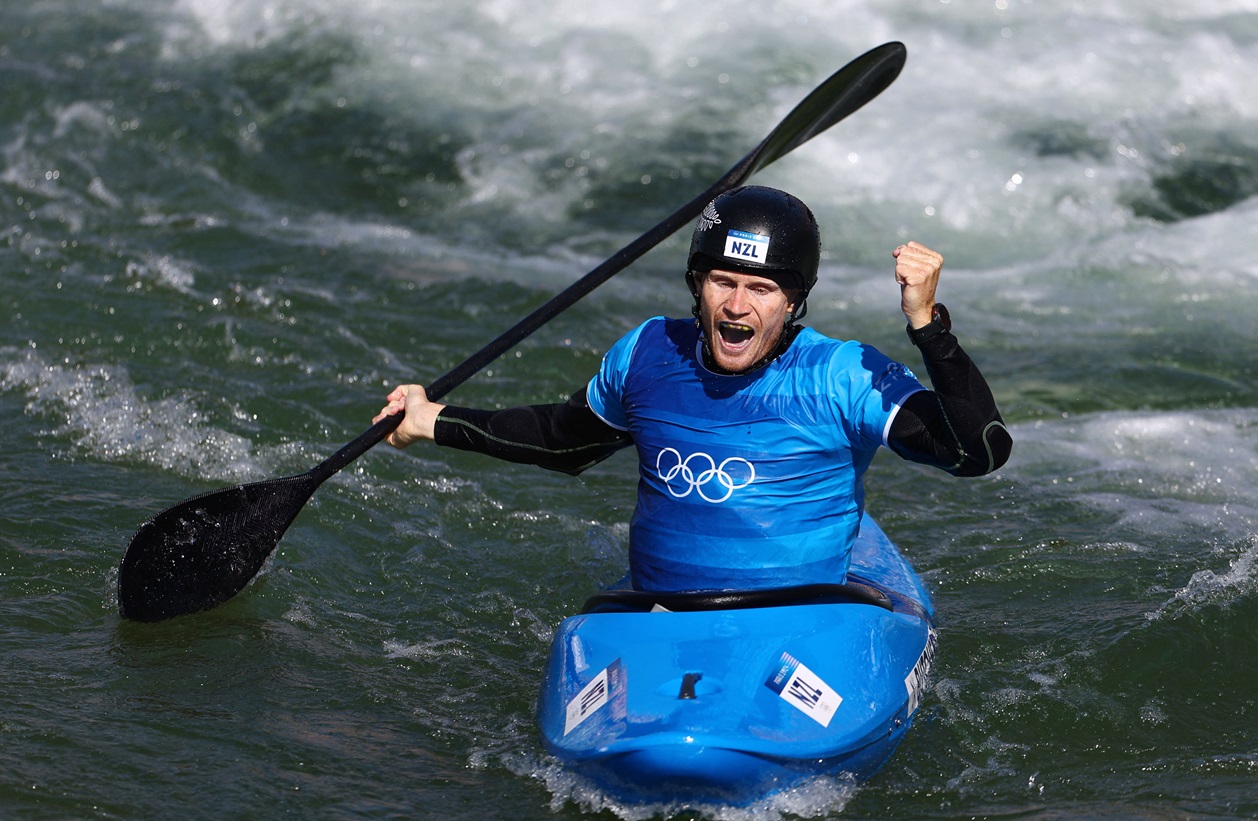 Finn Butcher celebrates after his run in the kayak cross final. Photo: Reuters